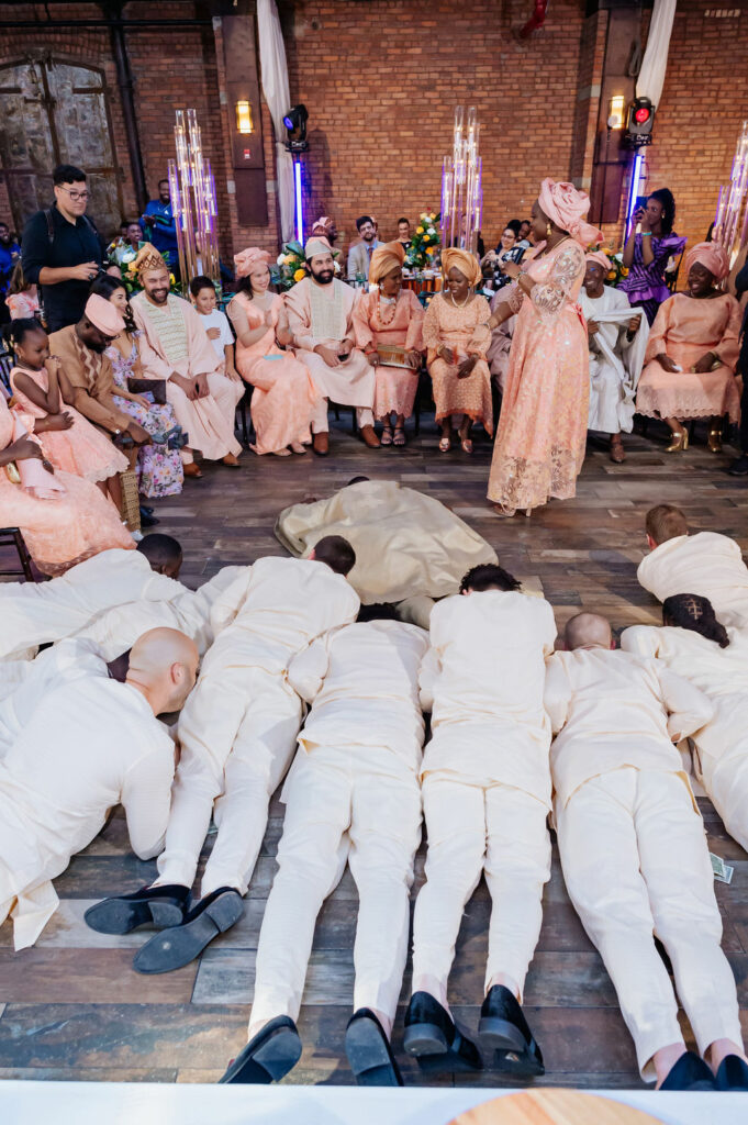 Groom lies on floor Nigerian Wedding Ceremony Practices