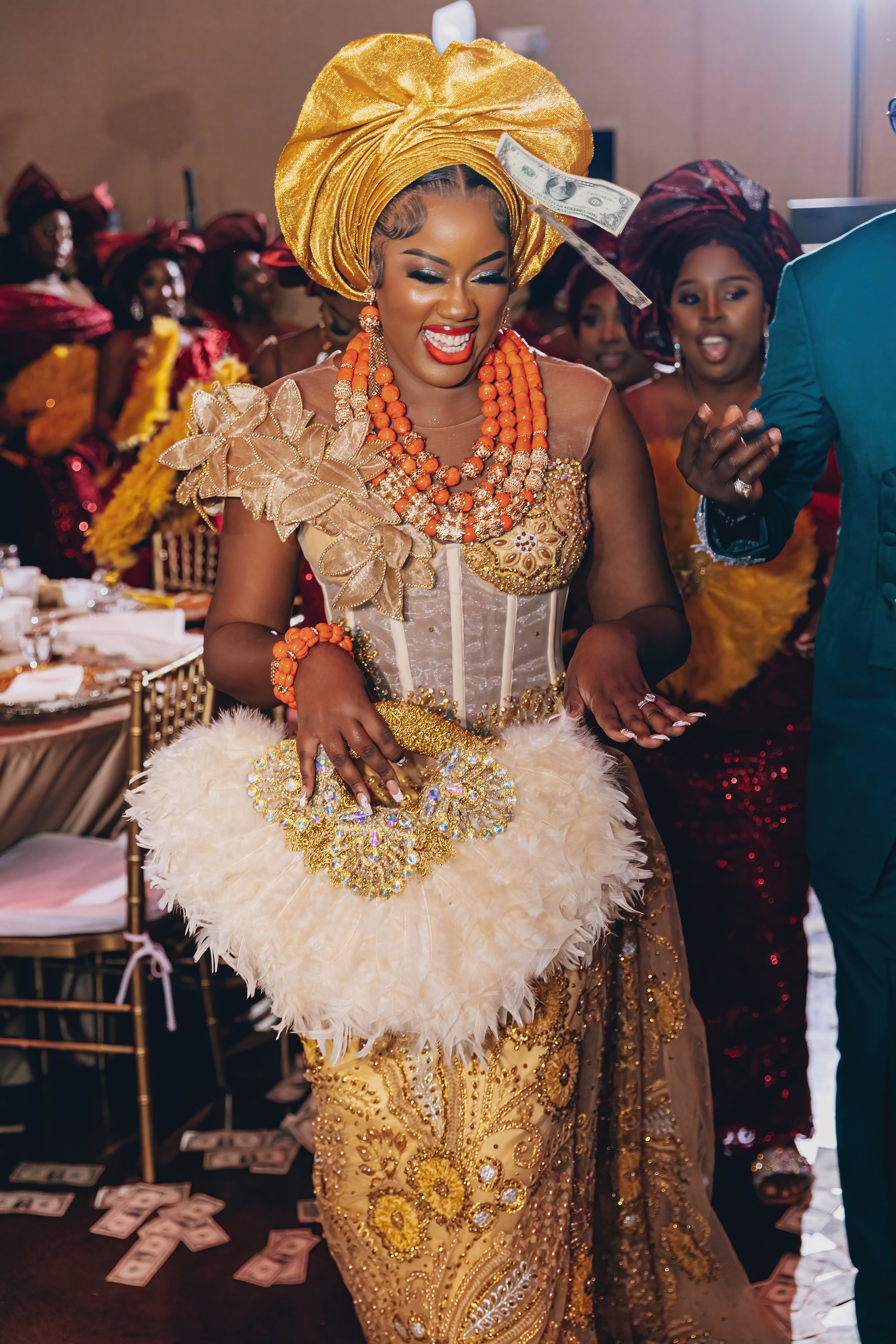 Bride in traditional nigerian wedding attire money spraying