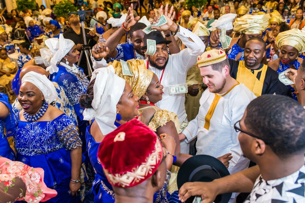 colorful money spraying nigerian wedding