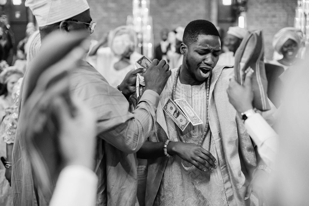 nigerian wedding groom money spraying