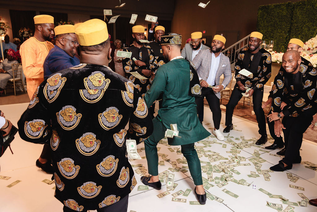 vibrant money spraying nigerian wedding