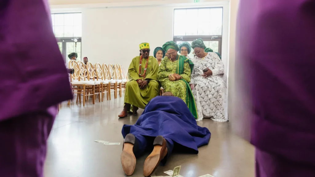 yoruba groom prostrating in engagement ceremony